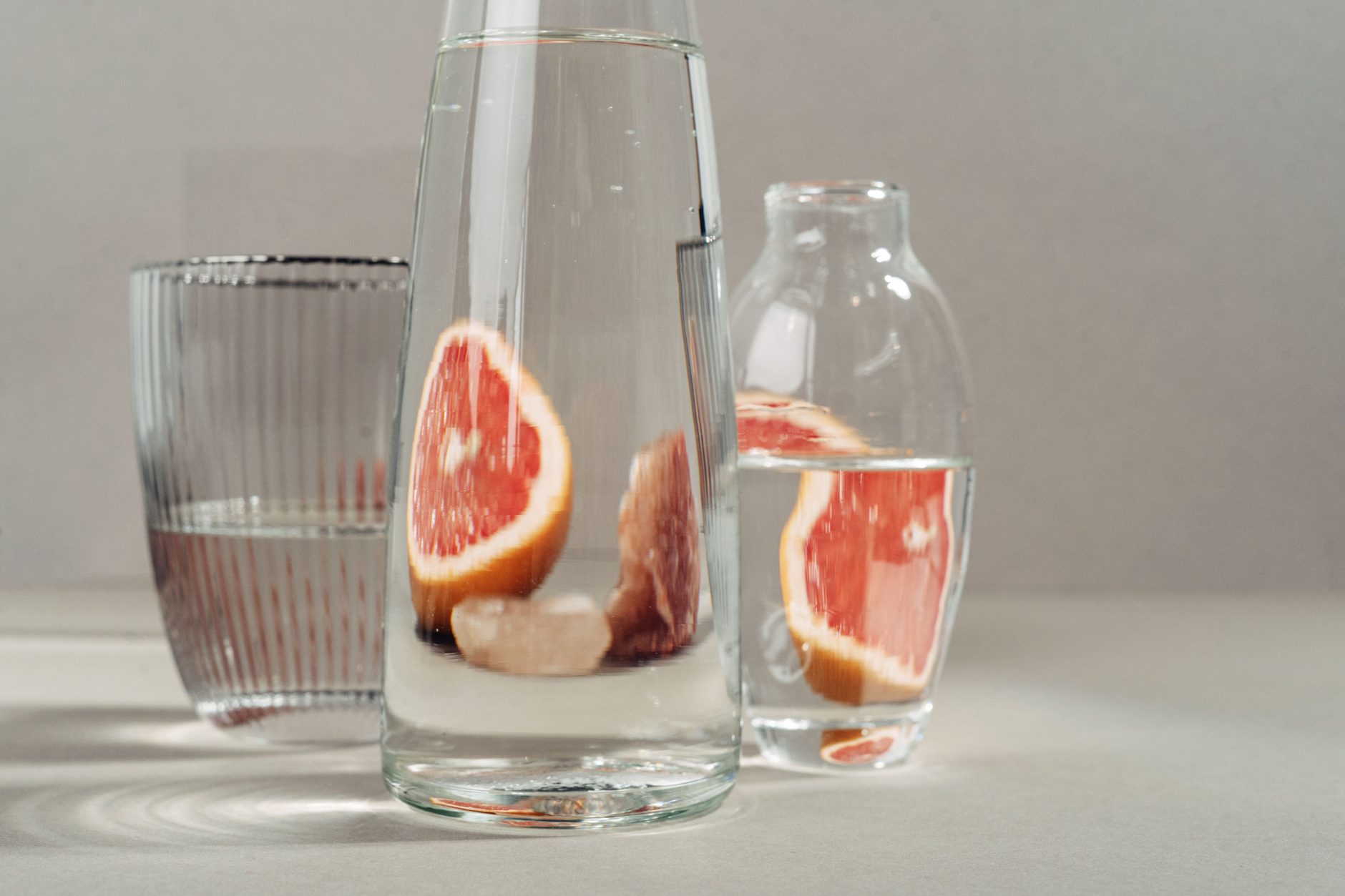 Carafes of water with fresh citrus slices